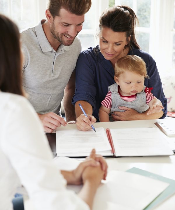 family-with-baby-meeting-financial-advisor-at-home.jpg